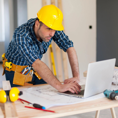 construction worker with a laptop