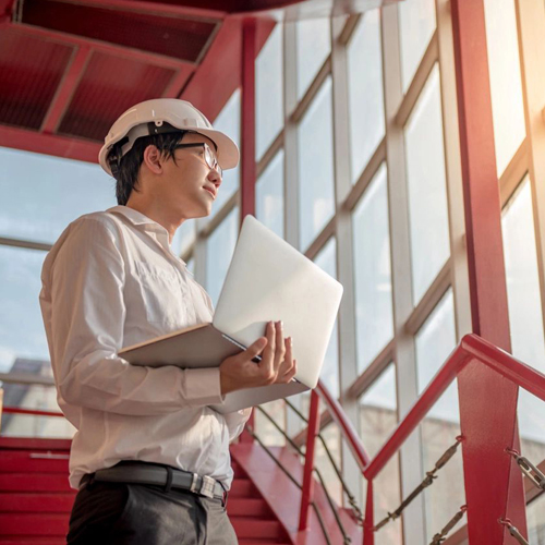 engineer holding a laptop